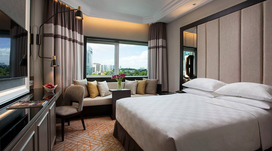 Orchard Road hotel room with night city view